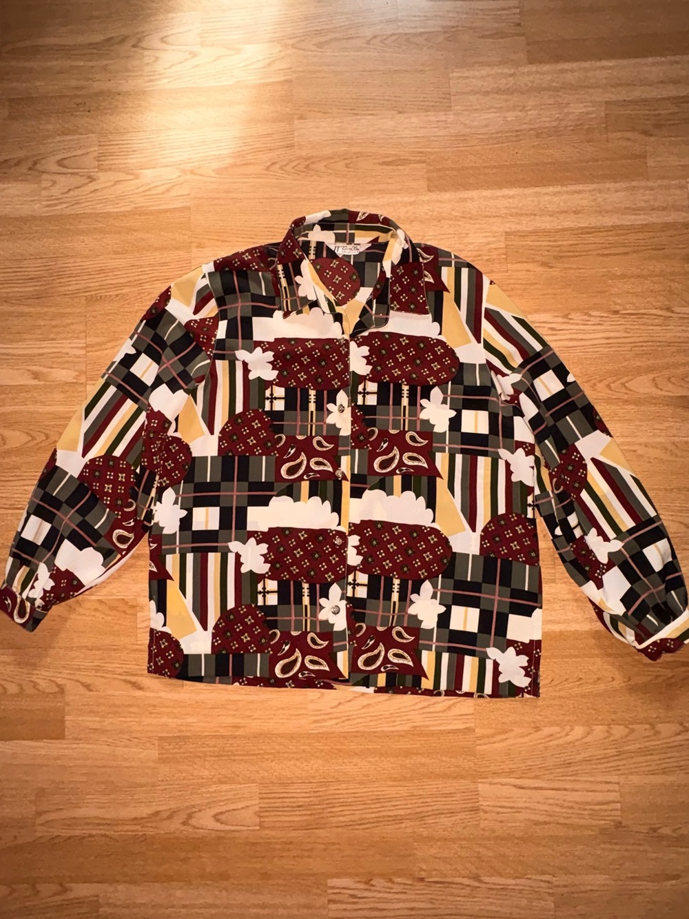 Patterned plaid and paisley button down shirt
